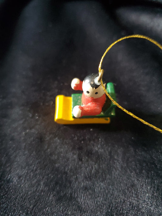 Vintage Miniature Wood Child On Sled Christmas Tree Ornament. 1" Tall